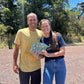 image of two happy people holding Kokua Farms chocolate bars